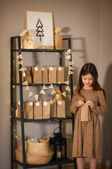 simple Christmas advent calendar made from craft paper bags for kids. easy diy