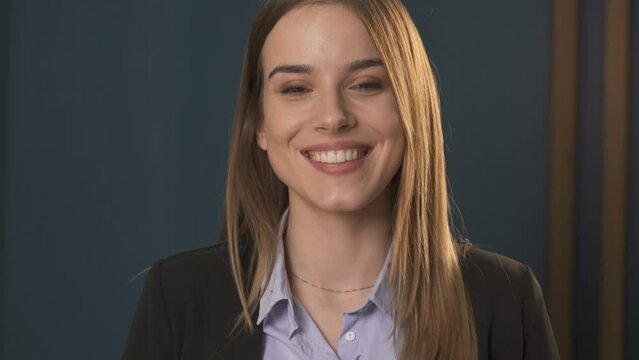 Receptionist speaking to guest, close up