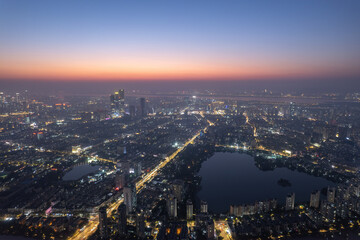 Aerial photography of the night view of Nanjing's Mochou Lake and the bustling city