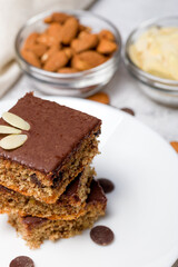 Chocolate almond dough. Traditional chocolate dough decorated with almond flakes