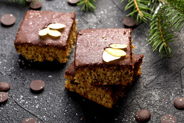 Chocolate almond dough. Traditional Christmas chocolate dough decorated with almond flakes