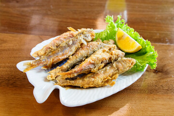 travel to Georgia - portion of fried Black Sea red mullet on plate in local cafe in Batumi city