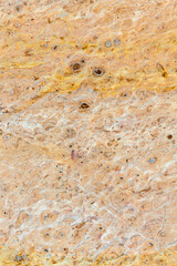 travel to Georgia - textured natural tuff wall tile close up of Holy Trinity Church on Sameba hill in Batumi city