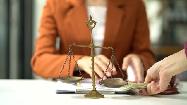 Lawyer accepts money, bribes businessman for partner in corruption in workplace.