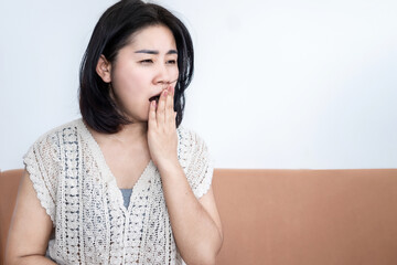 lack of sleep ,sleep deprivation concept with Asian woman yawning , sleepy and fatigue during...