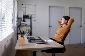 Young business asian woman work on laptop desk doing math finance on an office desk, tax, report, accounting, statistics, and analytical research concept