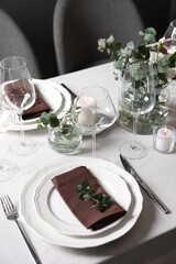 Beautiful table setting with silverware and floral decor