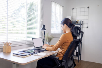 Young business asian woman work on laptop desk doing math finance on an office desk, tax, report, accounting, statistics, and analytical research concept - obrazy, fototapety, plakaty