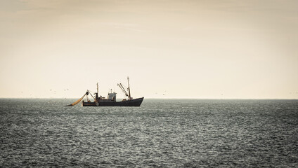 fishing trawler boat at open sea