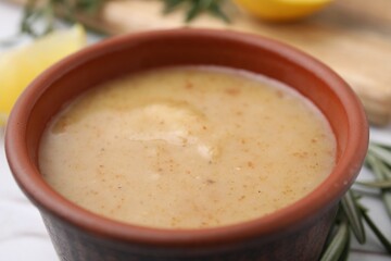 Delicious turkey gravy in bowl on table, closeup