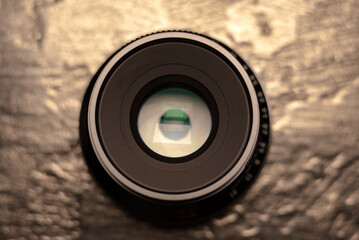 Black Photo Lens for camera. Close up, open aperture in lens. Photo or video equipment.