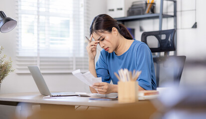 Frustrated desperate millennial woman checking bills for payments, holding receipts, getting upset about overspending, too high mortgage, insurance fees. Homeowner analyzing costs, expenses, budget
