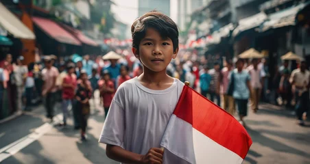 Fotobehang Indonesian boy holding Indonesia flag in Jakarta street  © Issaka