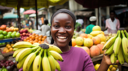 Smiling african  woman banana seller  - obrazy, fototapety, plakaty