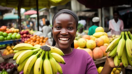 Foto op Canvas Smiling african  woman banana seller  © Issaka