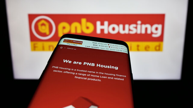 Stuttgart, Germany - 11-24-2023: Smartphone with website of Indian financial company PNB Housing Finance Limited in front of business logo. Focus on top-left of phone display.