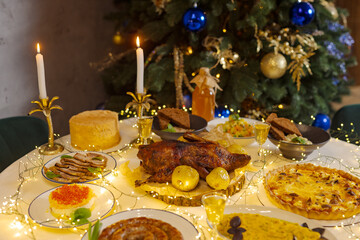 beautiful festive Christmas table with baked grilled chicken,