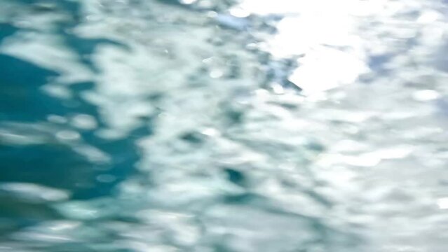  POV, Adventurous young man jumping off a cliff does a backflip from a bar into the sea in Greece ,adventurous lifestyle