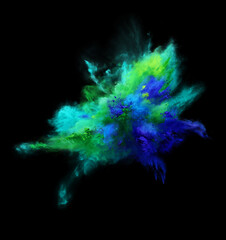 Beautiful explosion of green and blue powder on black background