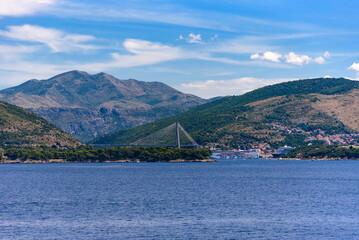 Suspension bridge - Frank Tudman's Bridge - over the water towards the famous croatian coastal town of Dubrovnik, Croatia