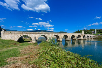 Visegrad, Bosnia and Herzegovina - August 13, 2023: Famous bridge on the Drina in Visegrad, Bosnia and Herzegovina. Mehmed Pasa Sokolovic Bridge on Drina River