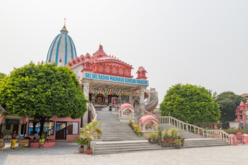  iskcon siliguri hindu god temple.
modern hare krishna temple with colorful idols.