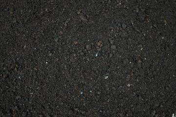 Close-up of grey sand and gravel texture for home renovation. 