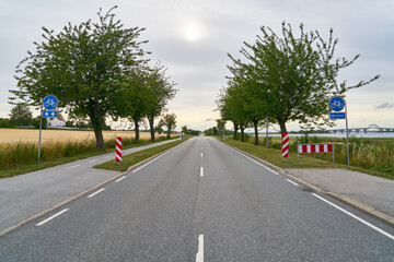 Fototapeta na wymiar Empty rural road with separated bike lane in Sweden