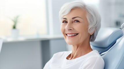 An elderly woman at the dental clinic smiles a smile with white, straight teeth. An appointment with a dentist