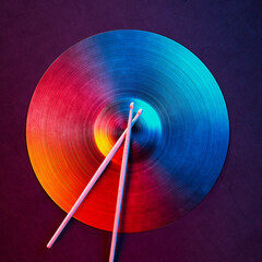 Dynamic Abstract Vinyl Record and Drumsticks in Vibrant Motion