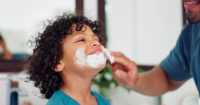 Father, child and playing with beard cream for grooming, beauty or fun bonding together in skincare at home. Happy dad applying lotion or after shave on son, kid or little boy for soft skin or facial