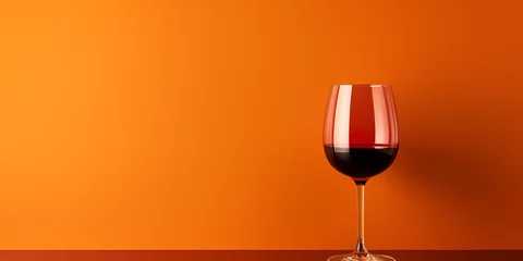 Fotobehang glass of wine ,Glass Wine Almost Finish ,Glass of red wine close up ,Wineglass with water over blue and orange background ,Glass with red wine on a plain red background hard generative ai   © Hadi