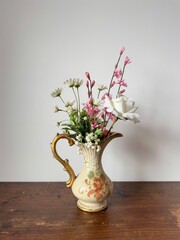 bouquet of flowers, artificial flowers in an antique vase