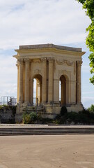 Fototapeta premium The Château d’eau du Peyrou at the Promenade du Peyrou in Montpellier in the region Occitania in France, in the month of June 