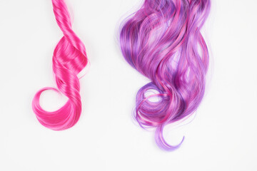 Natural looking shiny hair pink bright color, cosplay wig on a white background