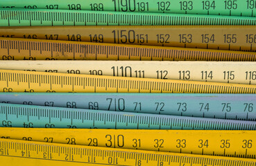 Old wooden folding meter ruler measuring centimeters