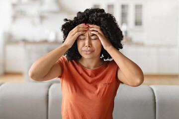 Headache Concept. Young black woman suffering from migraine at home - obrazy, fototapety, plakaty