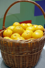 oranges in wicker basket at a market