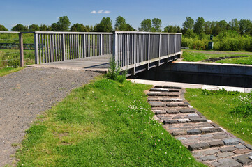 Close Up of Modern Bridge over Old Industrial Canal on Sunny Day