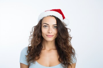 Beautiful Argentine Woman In Santa Hat On White Background. Сoncept Holiday Fashion Trends, Festive Accessories, Winter Photoshoot Ideas, Creative Christmas Portraits, Glamorous Santa Hat Style
