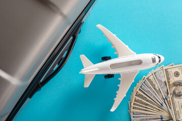 Air plane model and travel and accessories on blue background