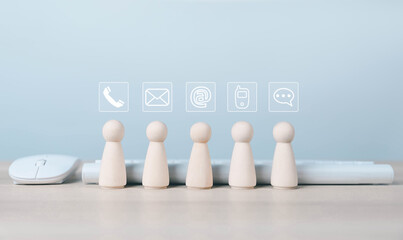 wood block shows a contact icon. contact customer support ( address, phone, email, mobile, call ). help from mail websites digital technology of business service. contact us concept