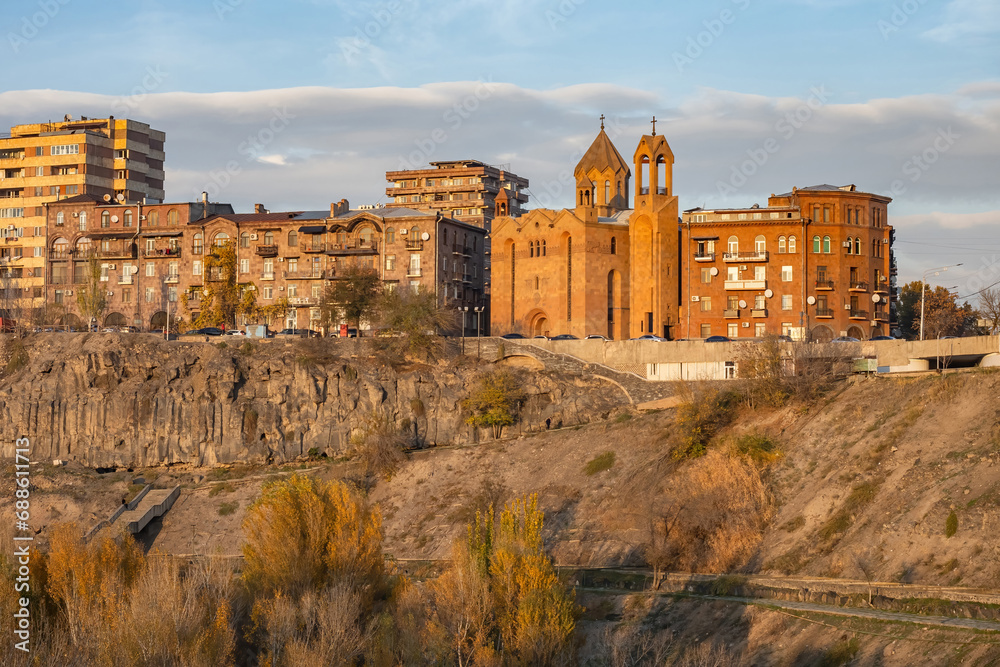 Wall mural Capital Armenia. Sights Yerevan. Cityscape with rocks. Surb Sarkis church. Architecture of Armenian cities. Yerevan on summer day. Vicar church on river bank. Tour in Armenia. Excursions, travel