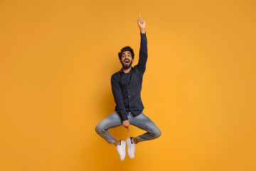 Check This. Indian Man Pointing Up And Down While Jumping In Air
