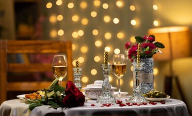 Empty establishing shot of valentines day dinning table arrangements for couple at restaurant - concept of wedding anniversary, romantic evening and date night preparation.