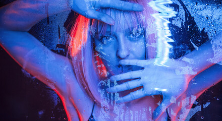 Futuristic style. Stylish woman with white hair is behind wet transparent plastic sheet
