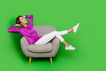 Full body length photo of laying armchair dreaming woman jobless waiting for interview in office isolated on green color background