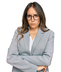 Young brunette woman wearing business clothes skeptic and nervous, disapproving expression on face...