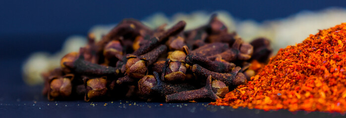 a bunch of clove; a bunch of spicy, food part, background