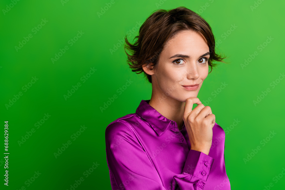 Wall mural Photo of adorable minded lady dressed purple trendy clothes presenting empty space news poster isolated on green color background